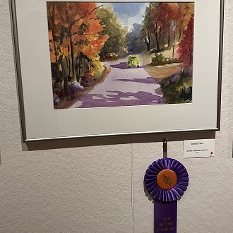 Best of Fall Color Award: “On Nutt Hill” by Charles Ausavich.  This watercolor truly talks about the fall colors and a drive in the country to admire the change of season. The sun dappled road and value choices draw you into the painting. Very nicely done!