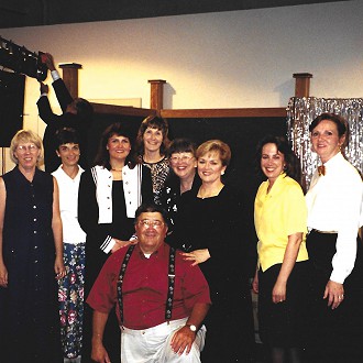 1999-2000 Inaugural Performing Arts Team created by Paul Brandl and Donna Hahn for the first large PAC production, “Broadway Revue!”  Paul (front) was the chairman. Members: L to R: Jan McKnight, Diane Mikolyzk, Donna Hahn, Julie Overby, Freddie Noordyk-Director of the Shows, Margaret Wittkopp, Deborah Heberlein, and Kate Herman. Paul and Freddie were serving as PAC Board Members in 1999.