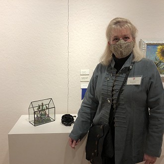 Merit Award to Eileen Urness for “House of Glass” polymer clay. Judge Patrick’s Comment: The attention to detail is nothing short of amazing. I’m intrigued by the drooping plants and their “submission” to the confines of the glass house.
