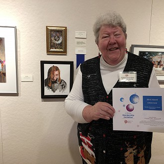 Merit Award to Barb Ramm for “Metallic Decoration on Wood” photography. Judge Patrick’s Comment: This small but engaging composition is rich with detail, depth and a frame that effectively embellishes it.