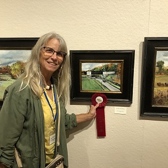 Best of Road America Award:  Linda Boehlke, Roaring Road America. I’m more than a little naïve about auto racing, but this painting finely captures a sense of speed by its’ linear, hard-edge articulation of the road. Makes a guy want to exceed the speed limit a little bit tonight…