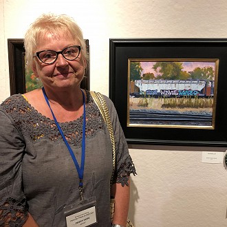 Merit Award: Peggy Hope, TRAINING DAY. I zeroed in on the flawless execution of the train tracks. I can “sense” the hardness of these tracks and there’s no question in my mind that they’re metal, they reminded me of similar tracks I walked along as a boy. Again, this is wonderfully nostalgic and the hip-hop text on the train car updates my boyhood memory to the “here-and-now.” The passage of sky at the top of the painting is a brilliant foil to the darkness of the track at the bottom of the painting.